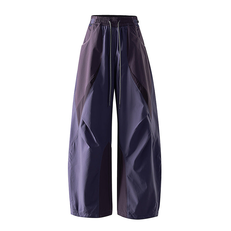 Women's wide technical balloon pants with drawstring waistband and insert panels
