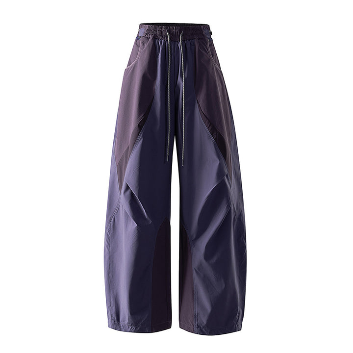 Women's wide technical balloon pants with drawstring waistband and insert panels