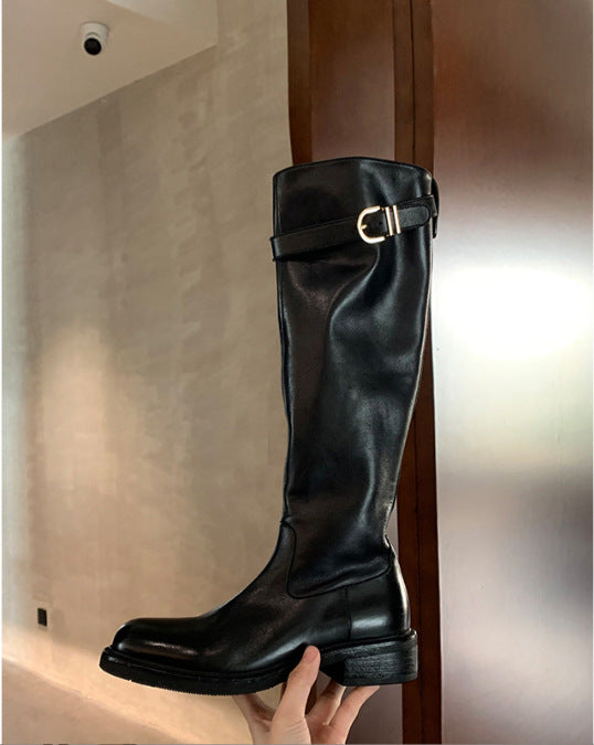 Ladies knee-high leather boots with flat profile sole and decorative strap Mune Fashion