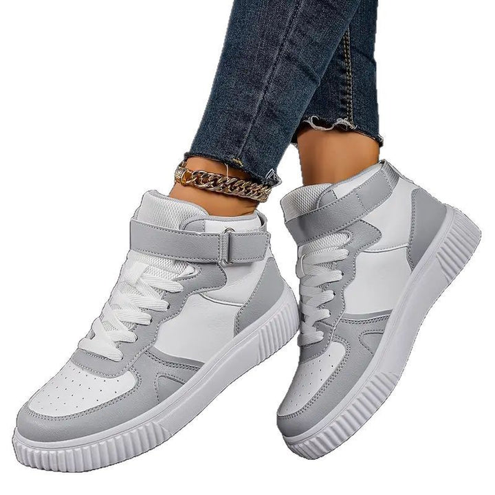 Women’s ankle-high polyurethane leather casual shoe with Velcro cuff, perforated toe cap, and textured rubber sole Mune Fashion