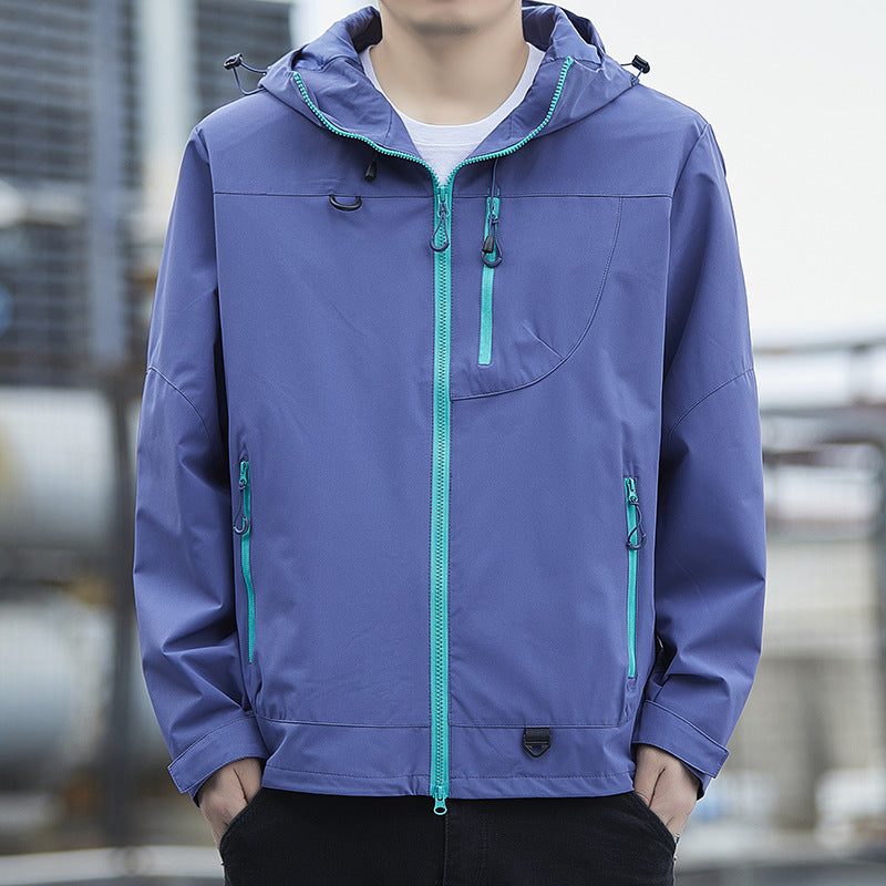 Men's lightweight Urban softshell hoodie jacket with contrasting zippers, chest pocket, and adjustable drawstring hem Mune Fashion