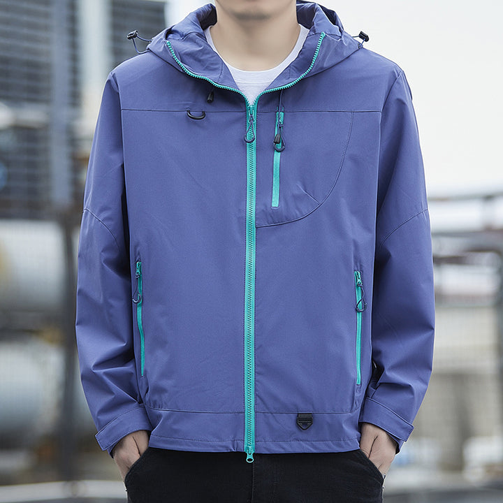 Men's lightweight Urban softshell hoodie jacket with contrasting zippers, chest pocket, and adjustable drawstring hem Mune Fashion