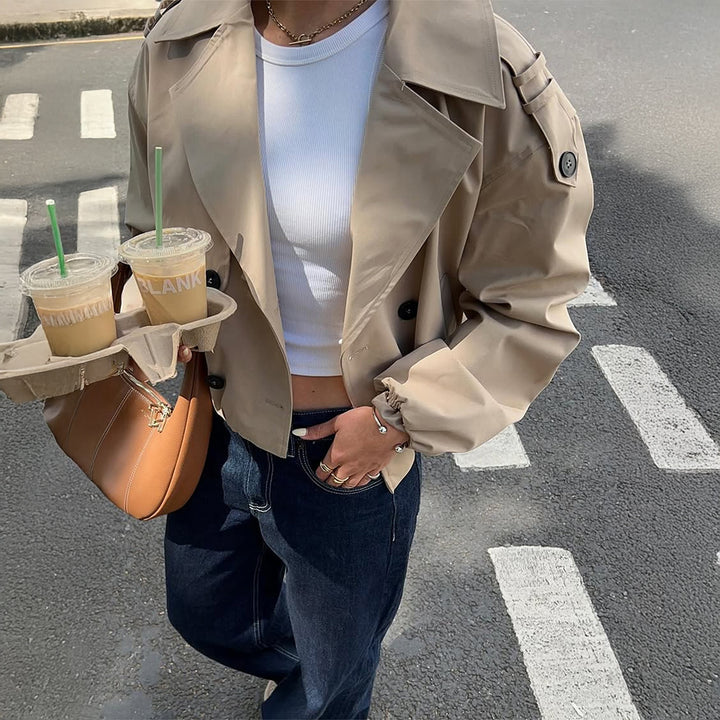 Women's shortened trench coat with double-breasted front, wide lapels, and elastic cuffs Mune Fashion