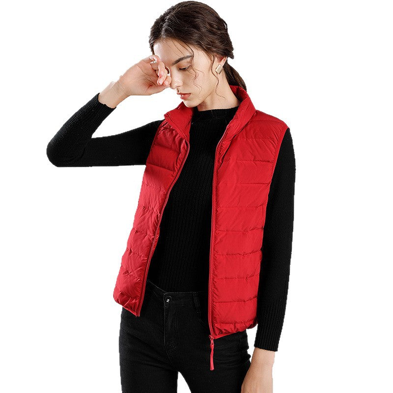 Women's packable quilted vest with flat down look, stand-up collar and side slip pockets Mune Fashion