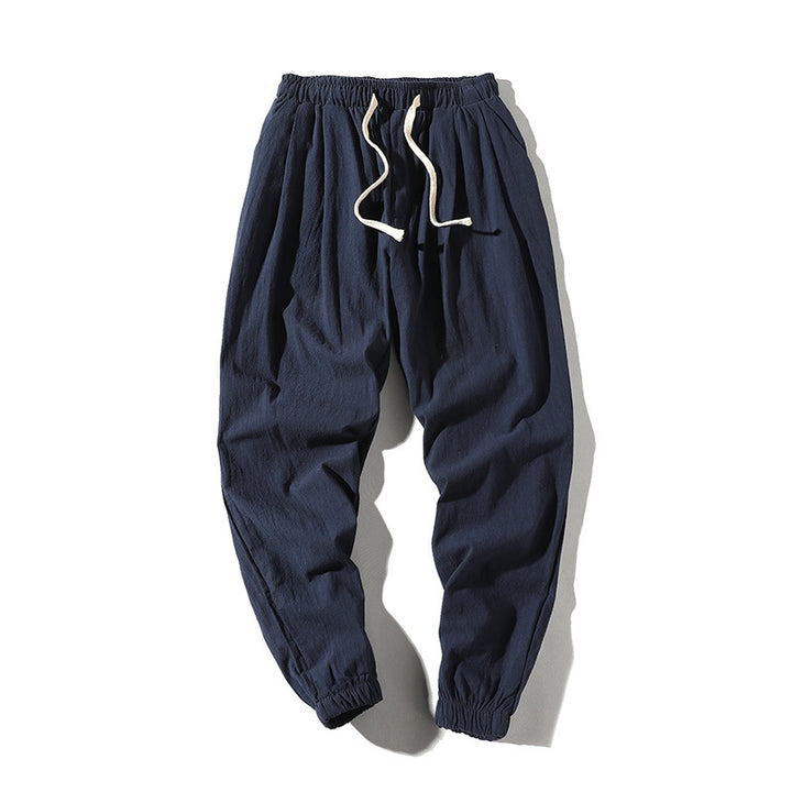 Men's loose joggers with elastic waistband, drawstring, side pockets, and elastic cuffs Mune Fashion