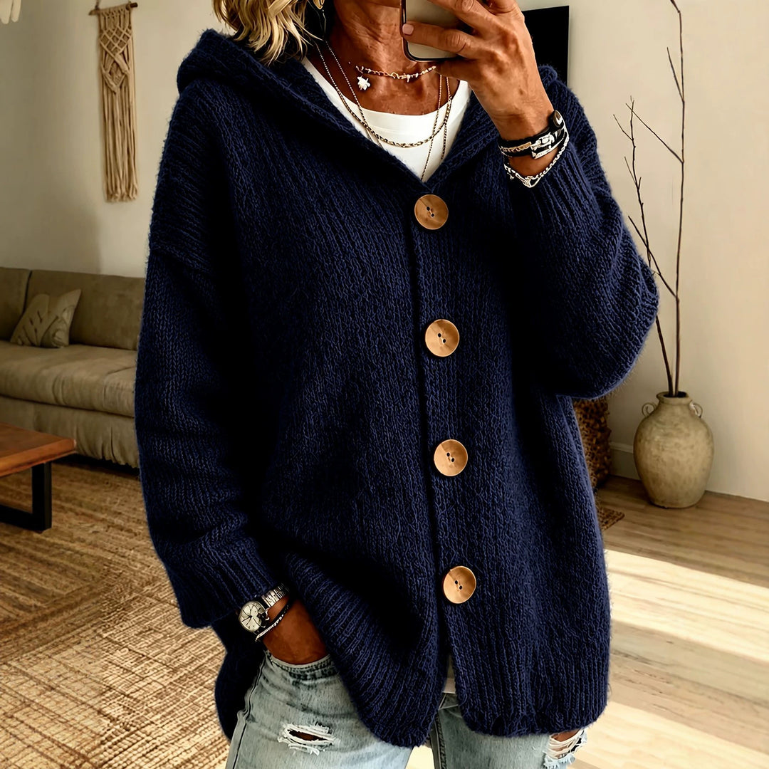 Women's chunky knit hooded cardigan with oversized silhouette, wooden button placket and ribbed cuffs Mune Fashion
