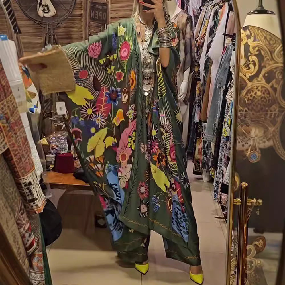 Women's extravagant maxi kaftan two-piece set with wide kimono sleeves, flared palazzo pants, and expressive floral print Mune Fashion