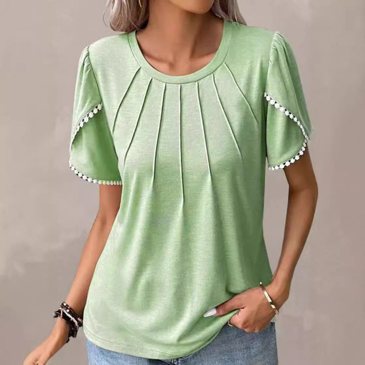 Women's round neck shirt with decorative pleated front, flutter sleeves and pompom trim Mune Fashion