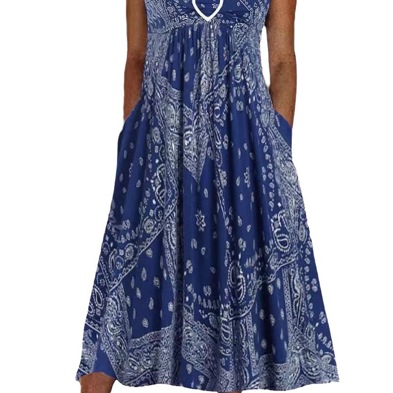 Women's airy maxi dress with paisley bandana print, gathered empire waist and practical side pockets Mune Fashion