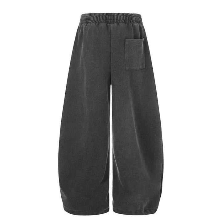 Women's extra-wide palazzo harem pants made of sweatshirt fabric with a high comfort waistband, drawstring, and large graphic print Mune Fashion