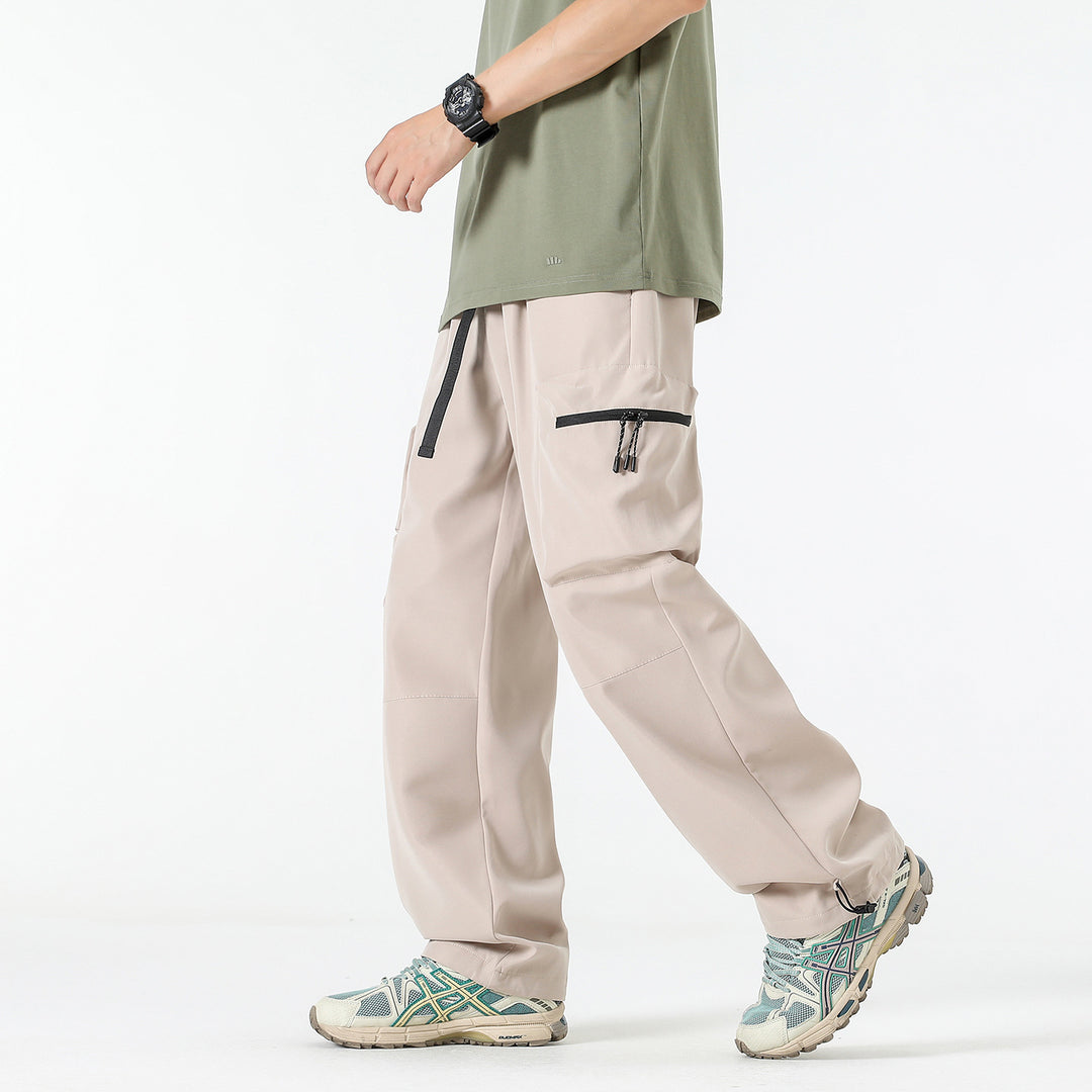 Men's loose technical cargo pants with multi-functional pockets, drawstring waistband, and adjustable leg closures Drune