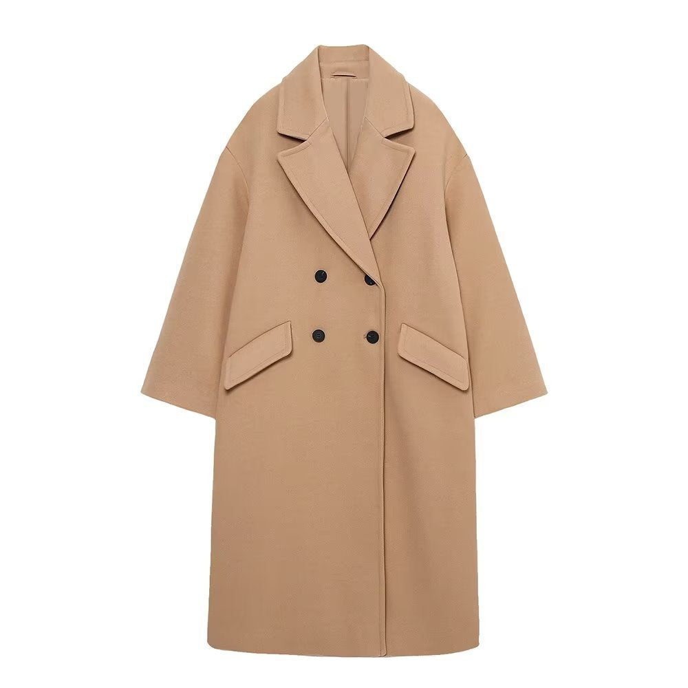 Women’s long cut boxy coat with double-breasted front, overlapping shawl collar, and generous flap pockets Mune Fashion