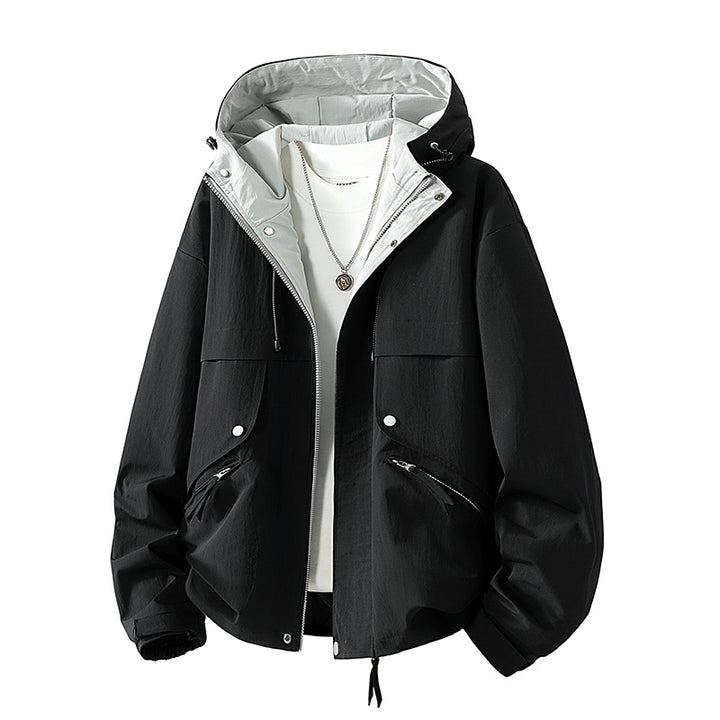 Unisex lightweight windproof transitional jacket with adjustable hood, drawstring, and zippered pockets Mune Fashion