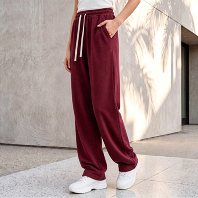 Women's wide lounge palazzo pants with high comfort waistband, drawstring, side pockets, and decorative side seam Mune Fashion