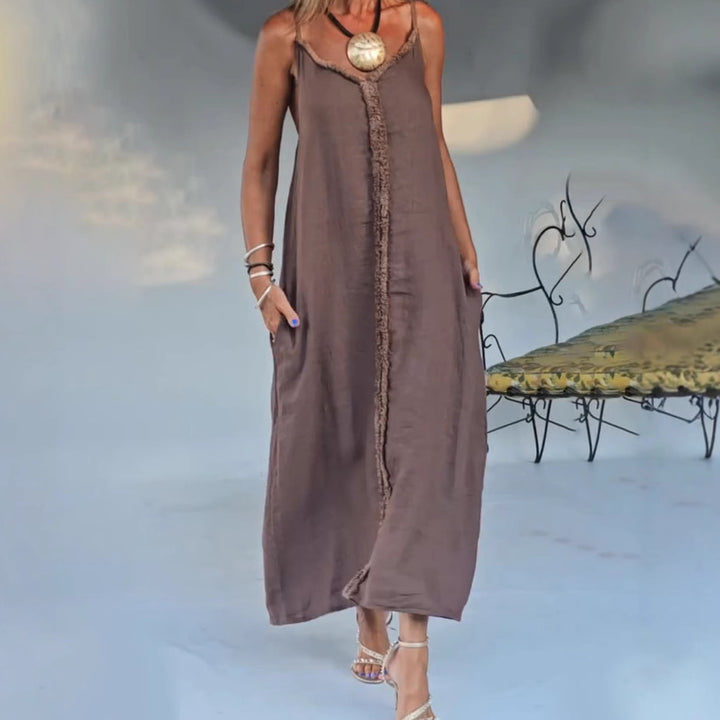 Women's airy linen-look maxi strap dress with fringed center seam and inset pockets Mune Fashion
