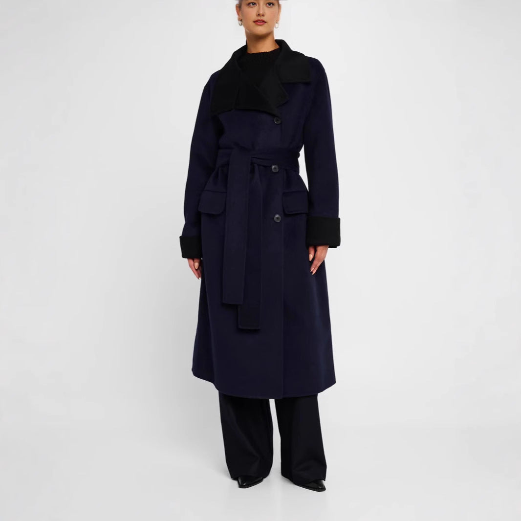 Women's tailored wool blend coat with tie belt, contrast lapel and flap pockets Mune Fashion