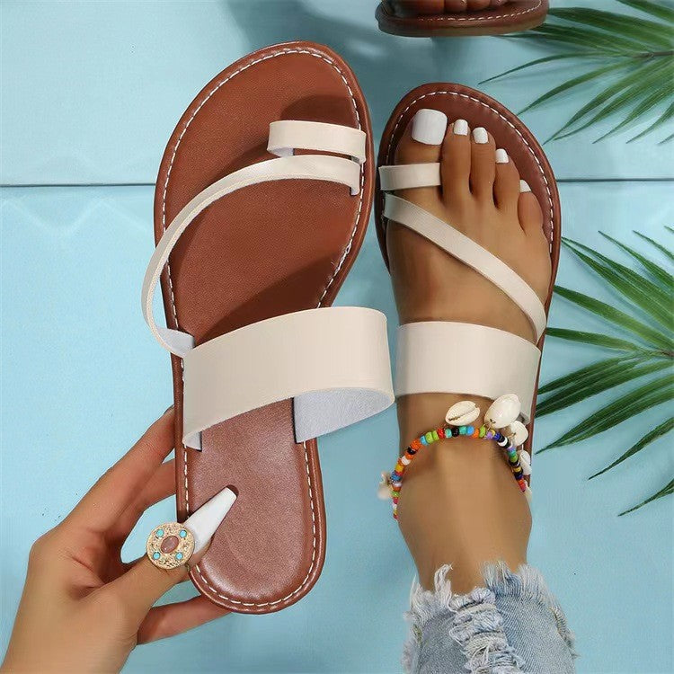 Women's flat faux leather thong sandal with crisscross straps and padded comfort footbed Mune Fashion