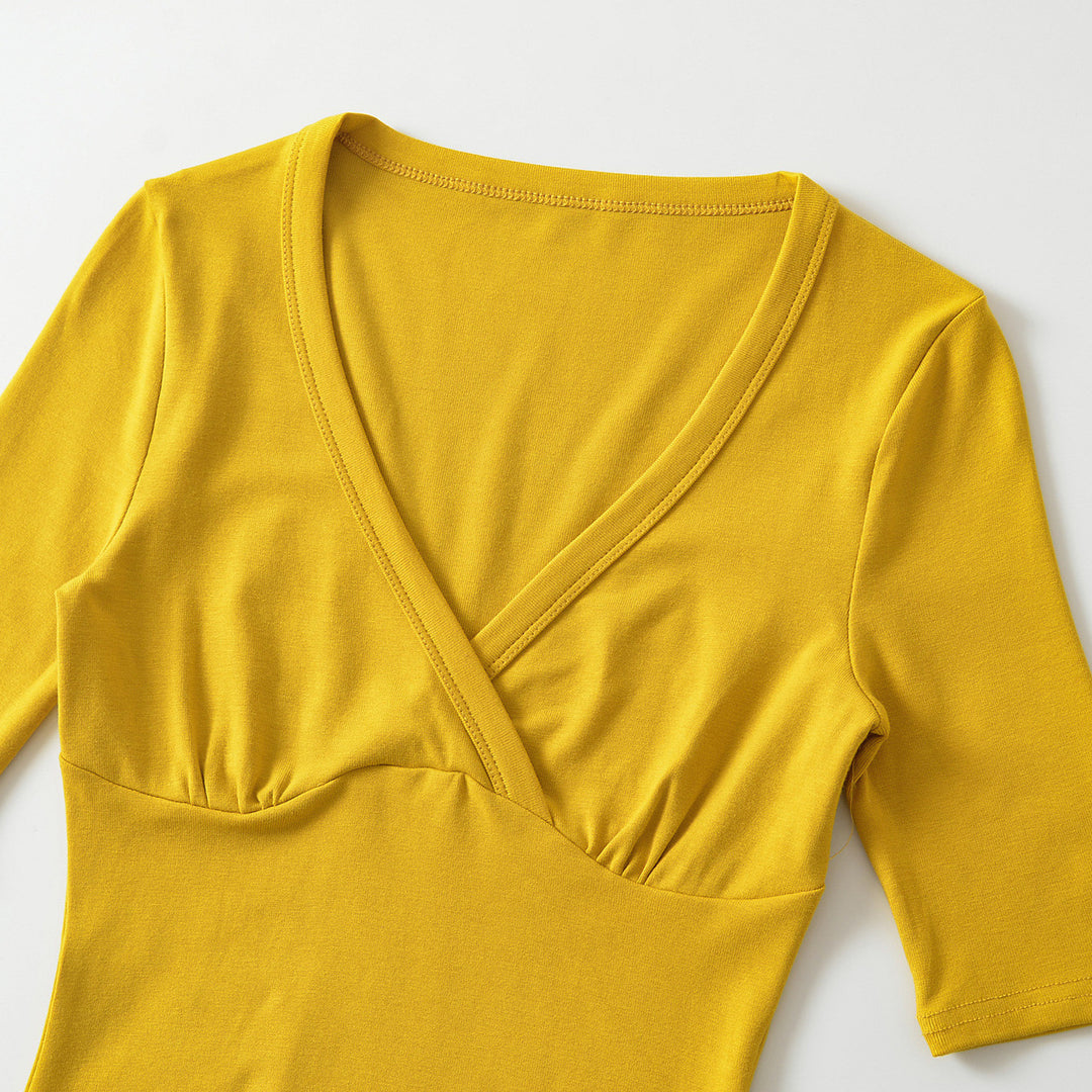 Women's body-hugging wrap shirt with deep V-neck, three-quarter sleeves, and waist accentuation Mune Fashion