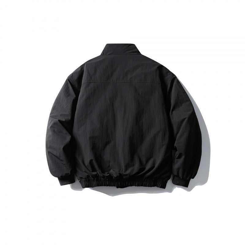 Unisex short boxy isolation jacket with diagonal flap pocket detail and elastic hem Mune Fashion