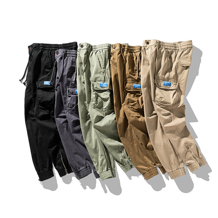 Herren Konisch geschnittene Utility-Cargo-Jogginghose mit Tunnelzugbund, Klapptaschen und Knöchelreißverschlüssen Mune Fashion