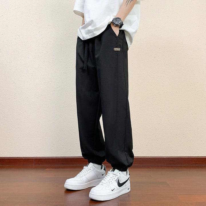 Men's sporty jogging pants with reflective details