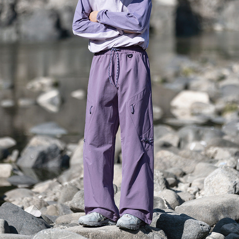 Men's loose technical cargo pants with drawstring, zipper pockets, and adjustable hem Mune Fashion