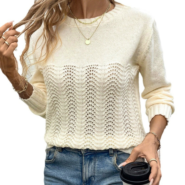 Women's open-work knitted pullover with wave pattern, round neckline, and elastic cuffs