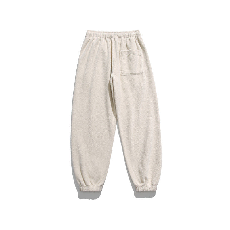 Men's wide-cut fleece jogging pants with elastic cuffs and side pockets Mune Fashion