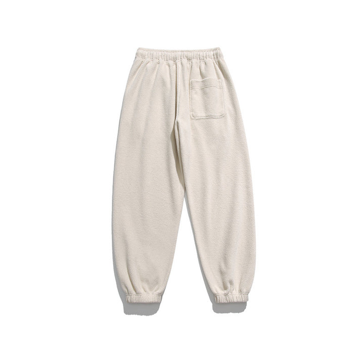 Men's wide-cut fleece jogging pants with elastic cuffs and side pockets Mune Fashion