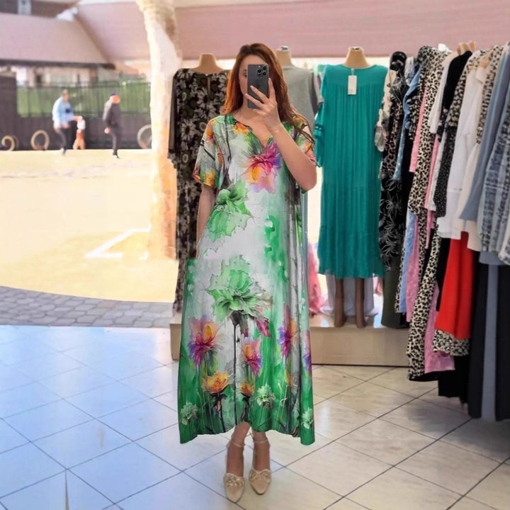 Women flowing maxi kaftan dress with V-neck and large watercolor floral print Mune Fashion