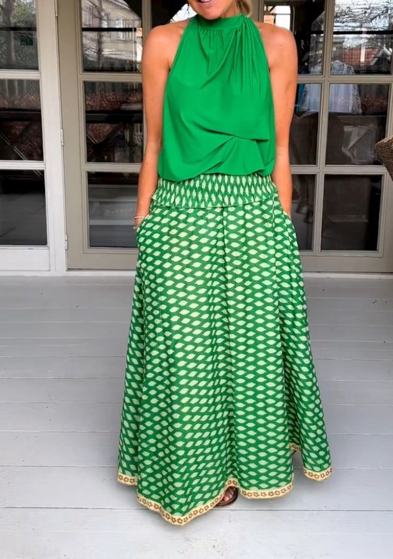 Women's two-piece halter neck set with gathered stand collar and patterned maxi skirt with elastic smocked waistband Mune Fashion