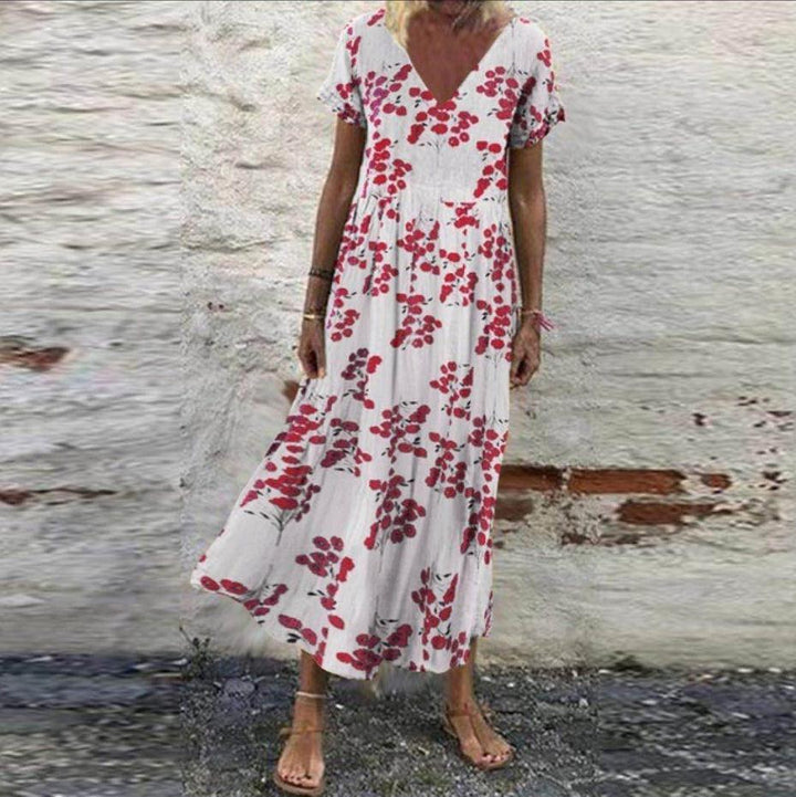 Women’s V-neck maxi dress with fine pleated skirt, empire bodice and short sleeves Mune Fashion
