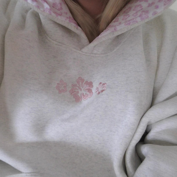 Women's hooded sweatshirt with floral embroidery and printed hood lining Mune Fashion