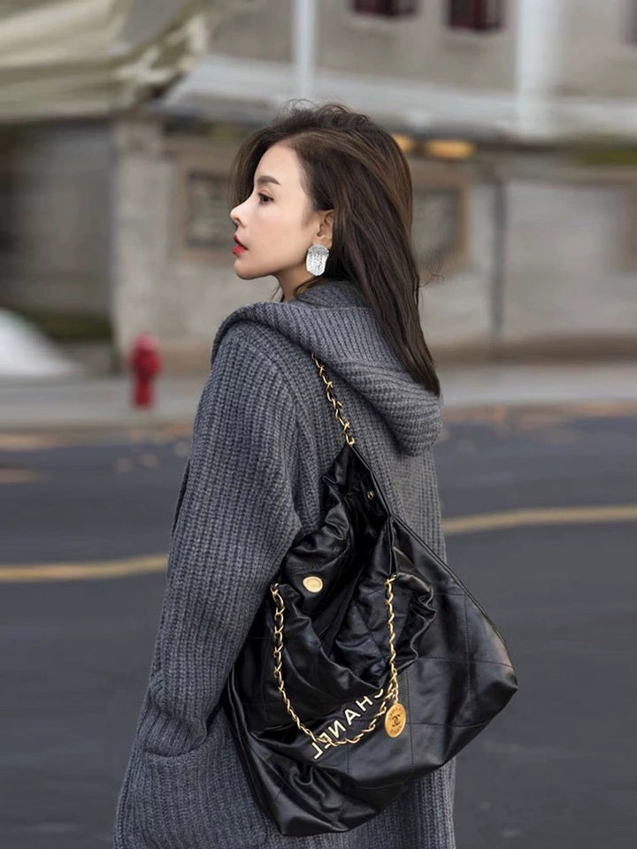 Women's Long Hooded Cardigan made of chunky rib knit with pocket inserts Mune Fashion