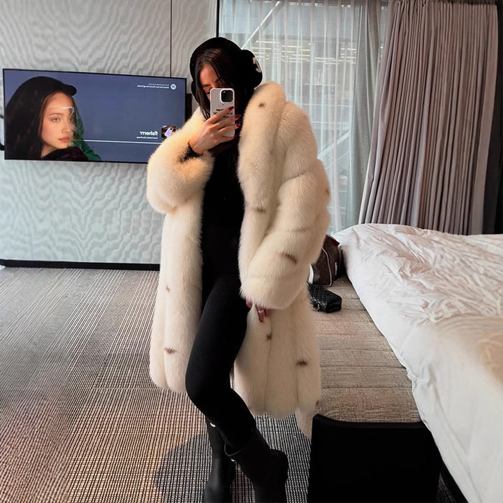 Women longer vegan faux fur coat with hood and voluminous fur collar Mune Fashion