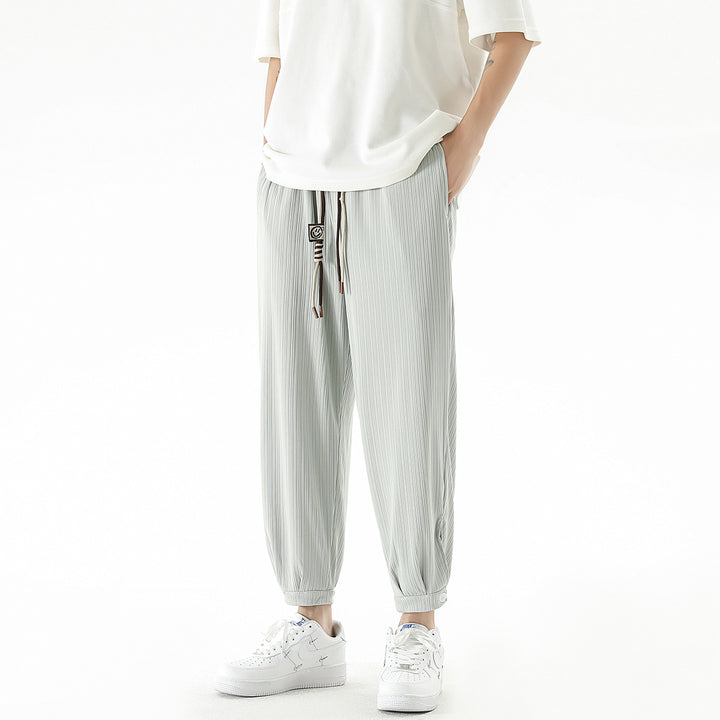 Men's loose-fitting leisure pants with drawstring, fine ribbed structure, and buttoned cuffs Mune Fashion
