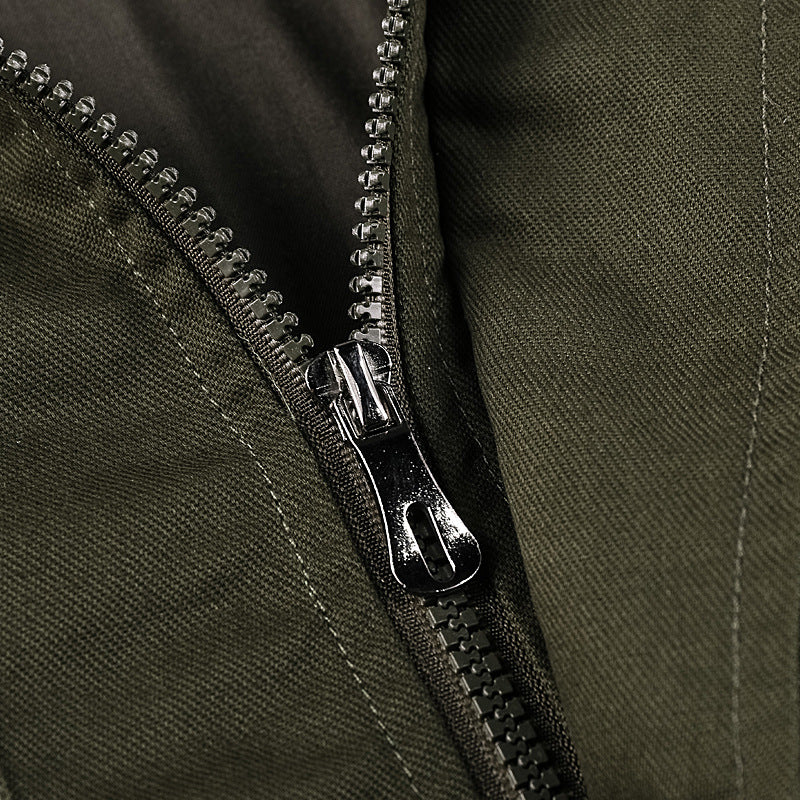 Men's rugged field jacket with multiple pockets, quilted inner lining, and ribbed cuffs.