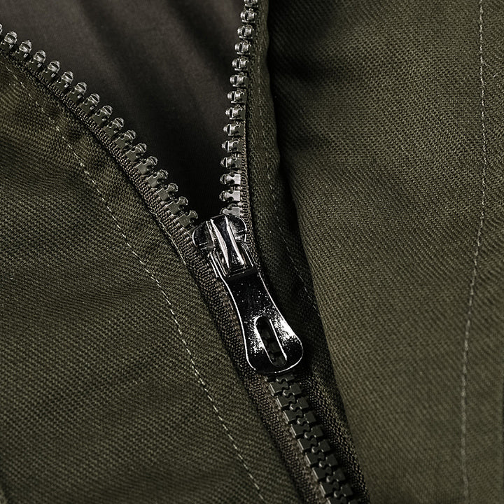 Men's rugged field jacket with multiple pockets, quilted inner lining, and ribbed cuffs.