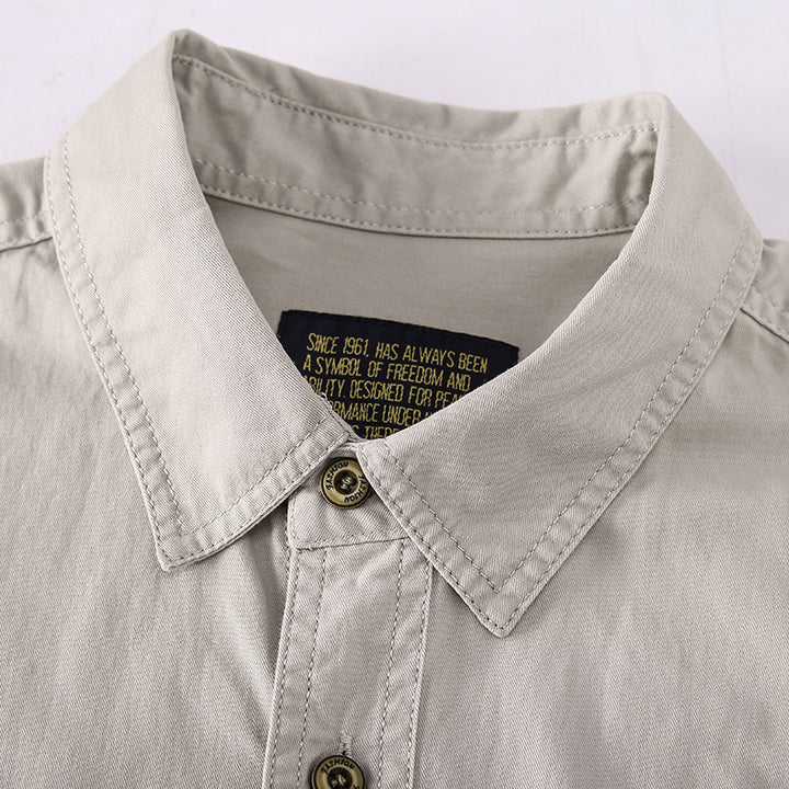 Men's robust utility shirt with patch chest pockets and sleeve tabs