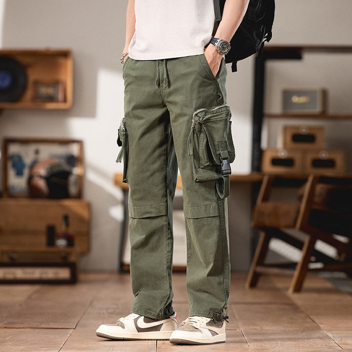 Men's multifunctional cargo pants in utility style with large flap and zip pockets, drawstring closure, and sturdy twill Mune Fashion