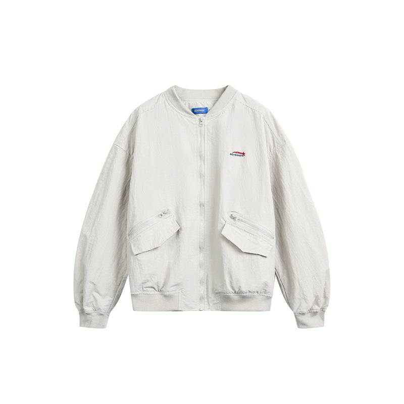 Unisex short cut lightweight nylon bomber jacket with utility pockets and ribbed hem Mune Fashion