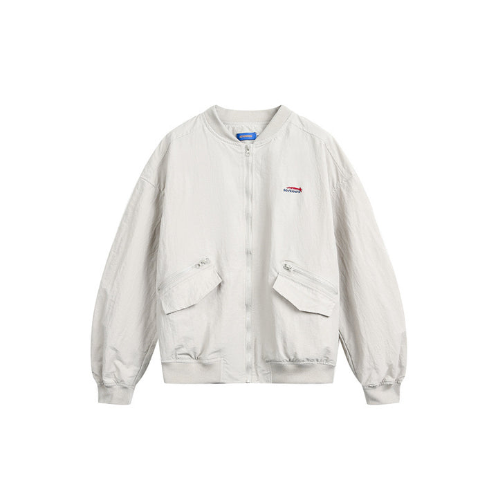 Unisex short cut lightweight nylon bomber jacket with utility pockets and ribbed hem Mune Fashion