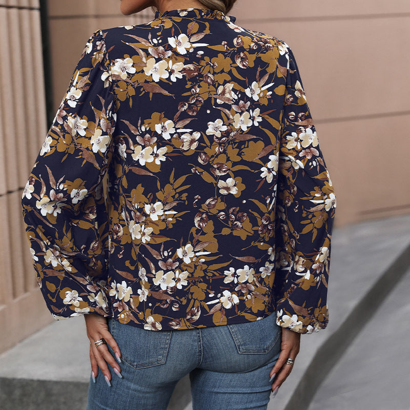 Women's lightweight chiffon blouse with floral all-over print, V-neck and voluminous gathered sleeves Mune Fashion