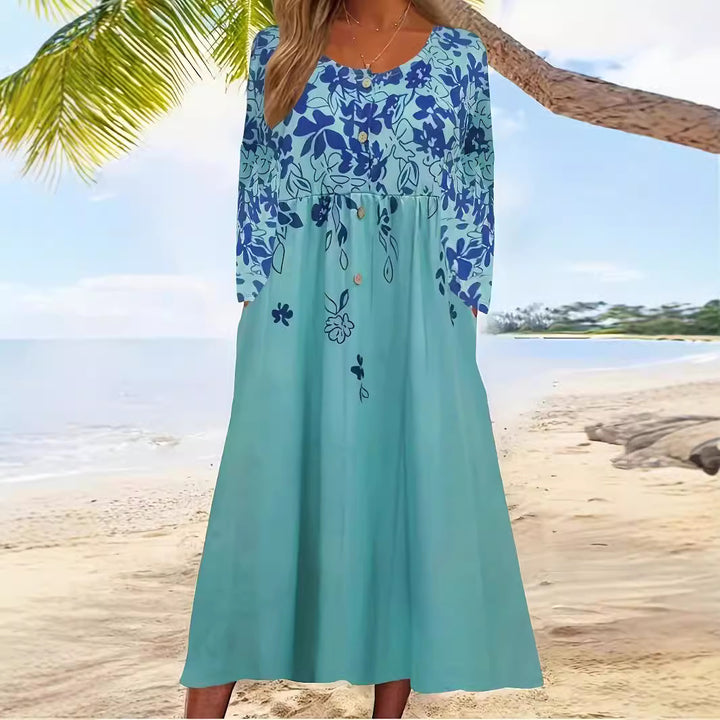 Ladies maxi dress with V-neck, floral print, button placket and side pockets Mune Fashion