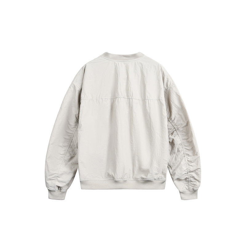 Unisex short cut lightweight nylon bomber jacket with utility pockets and ribbed hem Mune Fashion