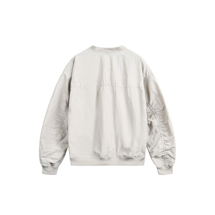 Unisex short cut lightweight nylon bomber jacket with utility pockets and ribbed hem Mune Fashion