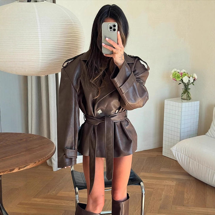 Women's short jacket made of faux leather with waistbelt and oversized shoulder area Mune Fashion