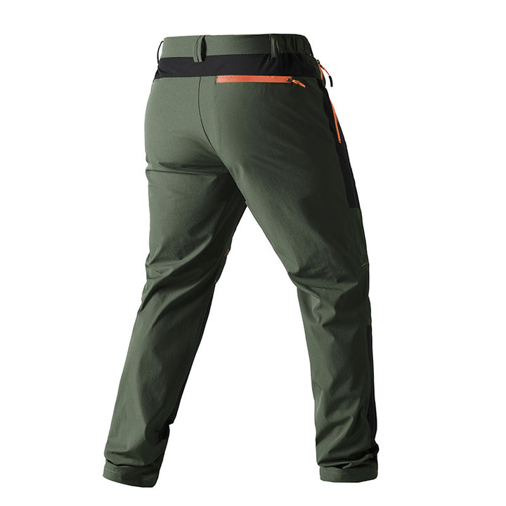 Men's functional trekking pants with reinforced knees, elastic waistband, and zipper pockets.
