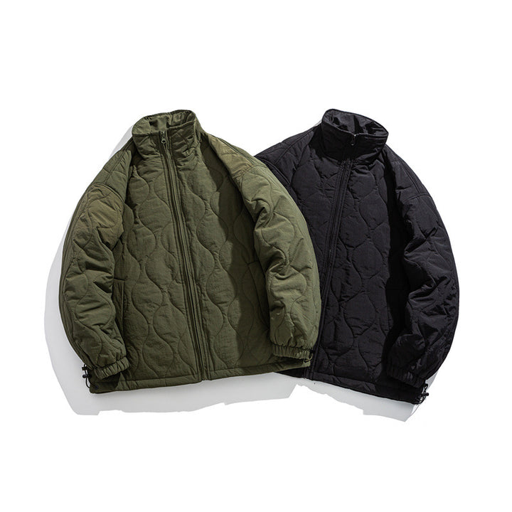Unisex Boxy quilted jacket in military liner style with high stand-up collar and adjustable hem Mune Fashion