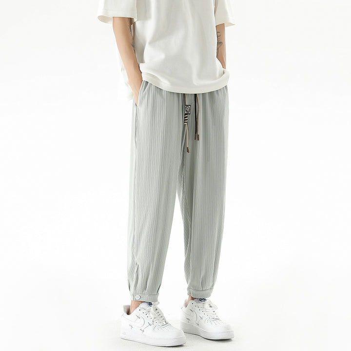 Men's loose-fitting leisure pants with drawstring, fine ribbed structure, and buttoned cuffs Mune Fashion
